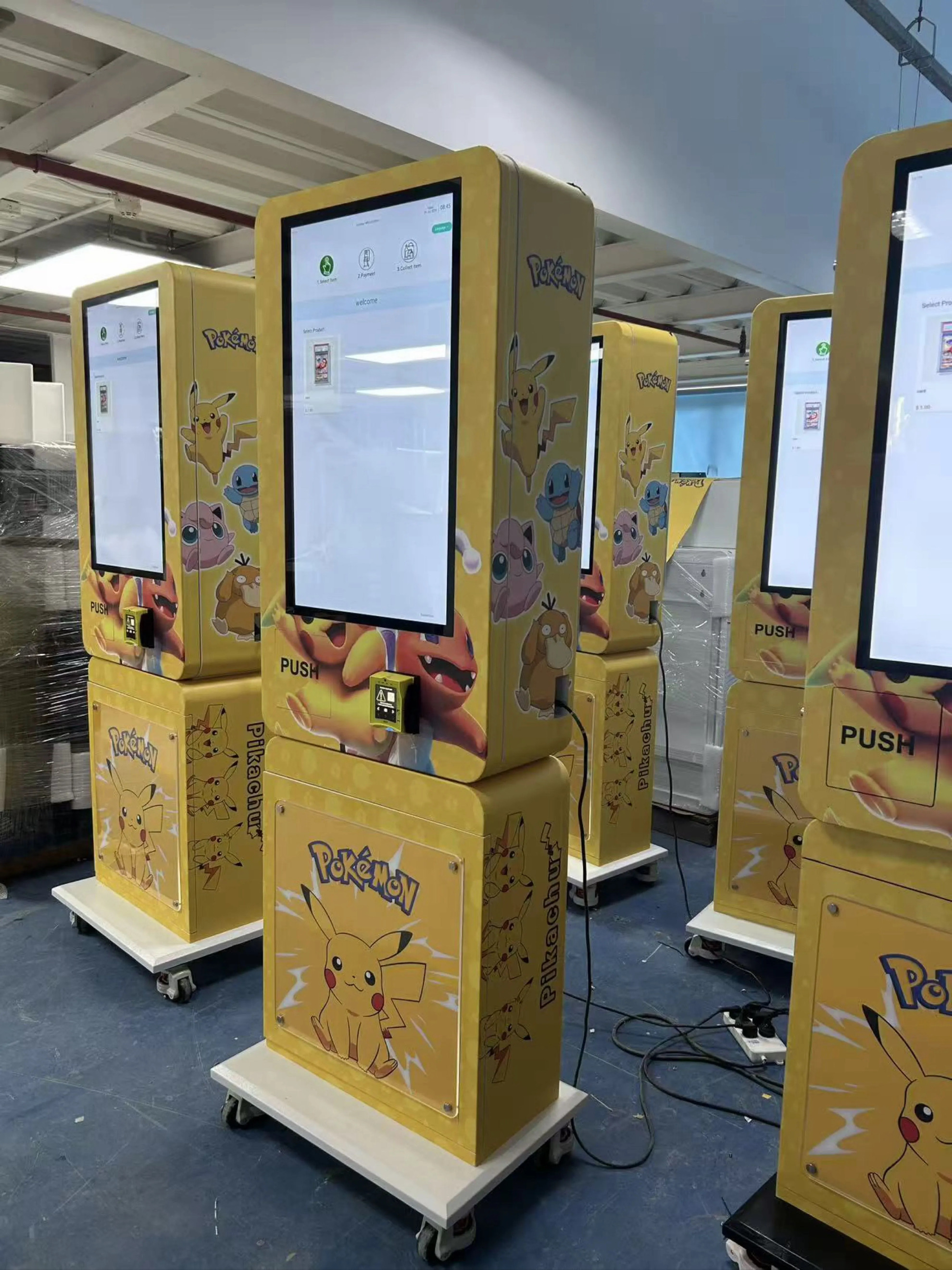 Yellow Pokémon trading card vending machine with a touchscreen